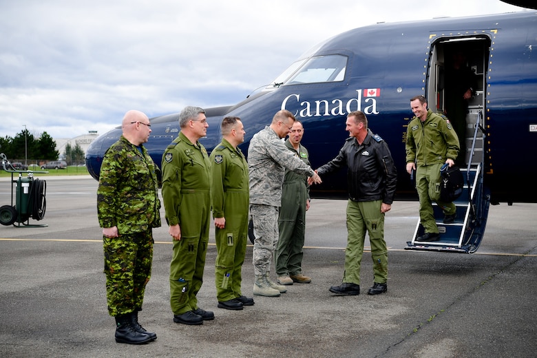 Canadian Brig. Gen. David Cochrane, 2nd Canadian Air Division commander, is greeted upon landing by 62nd Airlift Wing and Western Air Defense Sector leadership April 6.  As part of Cochrane’s official visit to Joint Base Lewis-McChord, he received a WADS mission briefing and operations floor tour prior to his attendance as the guest speaker for the WADS Canadian Detachment’s annual Mess Dinner marking the 93rd anniversary of the formation of the Royal Canadian Air Force. Pictured from left to right: Canadian Warrant Officer Rick Martin, WADS Canadian Detachment, Canadian Capt. Robert Bell, WADS Canadian Detachment, Canadian Lt. Col. Matt Wappler, WADS Canadian Detachment commander, Col. Gregor Leist, WADS commander and Col. Leonard Kosinski, 62nd Airlift Wing commander, Canadian Brig. Gen. David Cochrane, 2nd CAD commander, and Canadian Capt. Brian Noel, 2nd CAD commander executive assistant.  (U.S. Air Force photo by Kimberly D. Burke)