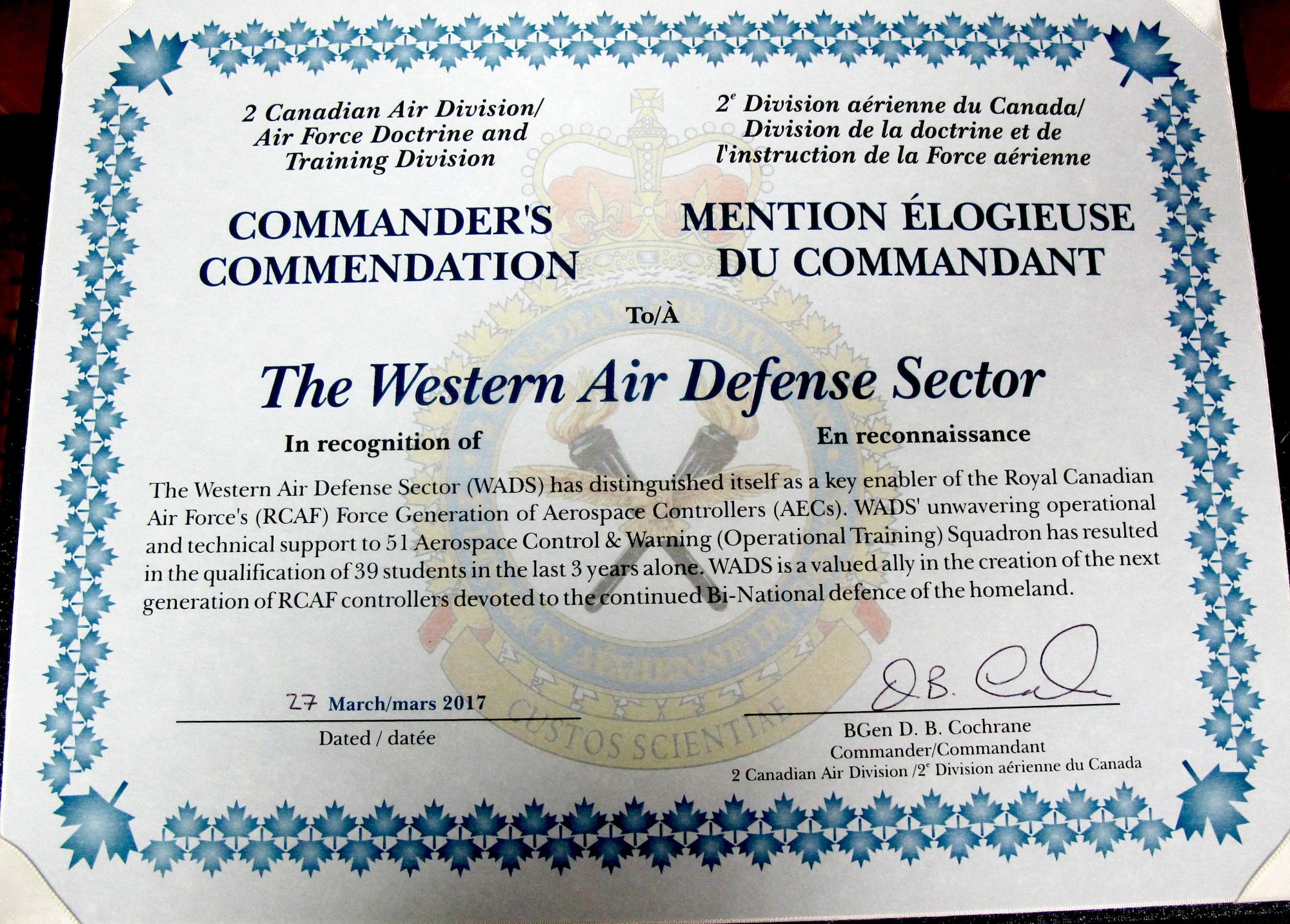 The 2nd Canadian Air Division Commander’s Unit Commendation citiation is presented to the Western Air Defense Sector during the Canadian Mess Dinner April 7 for providing critical live and virtual training to Canadian aerospace controllers from the 51 Aerospace Control and Warning (Operational Training) Squadron from North Bay, Ontario.