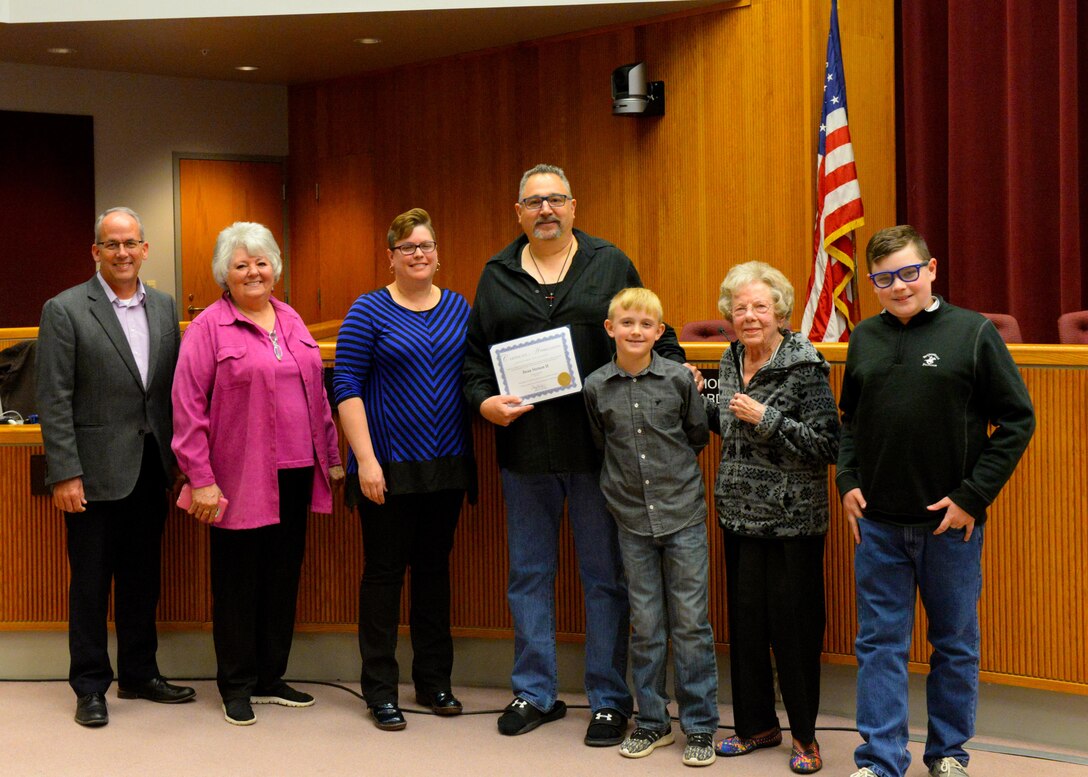 Dean Stetson II, the assistant fire chief at Ellsworth Air Force Base, S.D., receives the Veteran of the Month award at a city council meeting in Rapid City, S.D., April 17, 2017. Stetson was recognized for his military career which began in 1986, and the work he continues to do on base and within the Rapid City community. (U.S. Air Force photo by Airman Nicolas Z. Erwin)