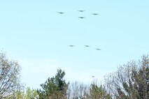 A group of B-25 bombers flies over the National Museum of the United States Air Force in a typical bomber staggered formation, April 18, 2017 as part of the 75th Anniversary of the Doolittle Raid Memorial Ceremony. They then flew over the museum one last time in the Missing Man formation and honored the 79 members of the original Raiders who have passed. The last living Raider, Lt. Col. (Ret.) Richard Cole, was a participant in the memorial ceremony. (U.S. Air Force photo/Wesley Farnsworth)