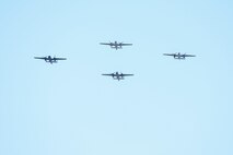 A group of B-25 bombers flies over the National Museum of the United States Air Force in a typical bomber staggered formation, April 18, 2017 as part of the 75th Anniversary of the Doolittle Raid Memorial Ceremony. They then flew over the museum one last time in the Missing Man formation and honored the 79 members of the original Raiders who have passed. The last living Raider, Lt. Col. (Ret.) Richard Cole, was a participant in the memorial ceremony. (U.S. Air Force photo/Wesley Farnsworth)