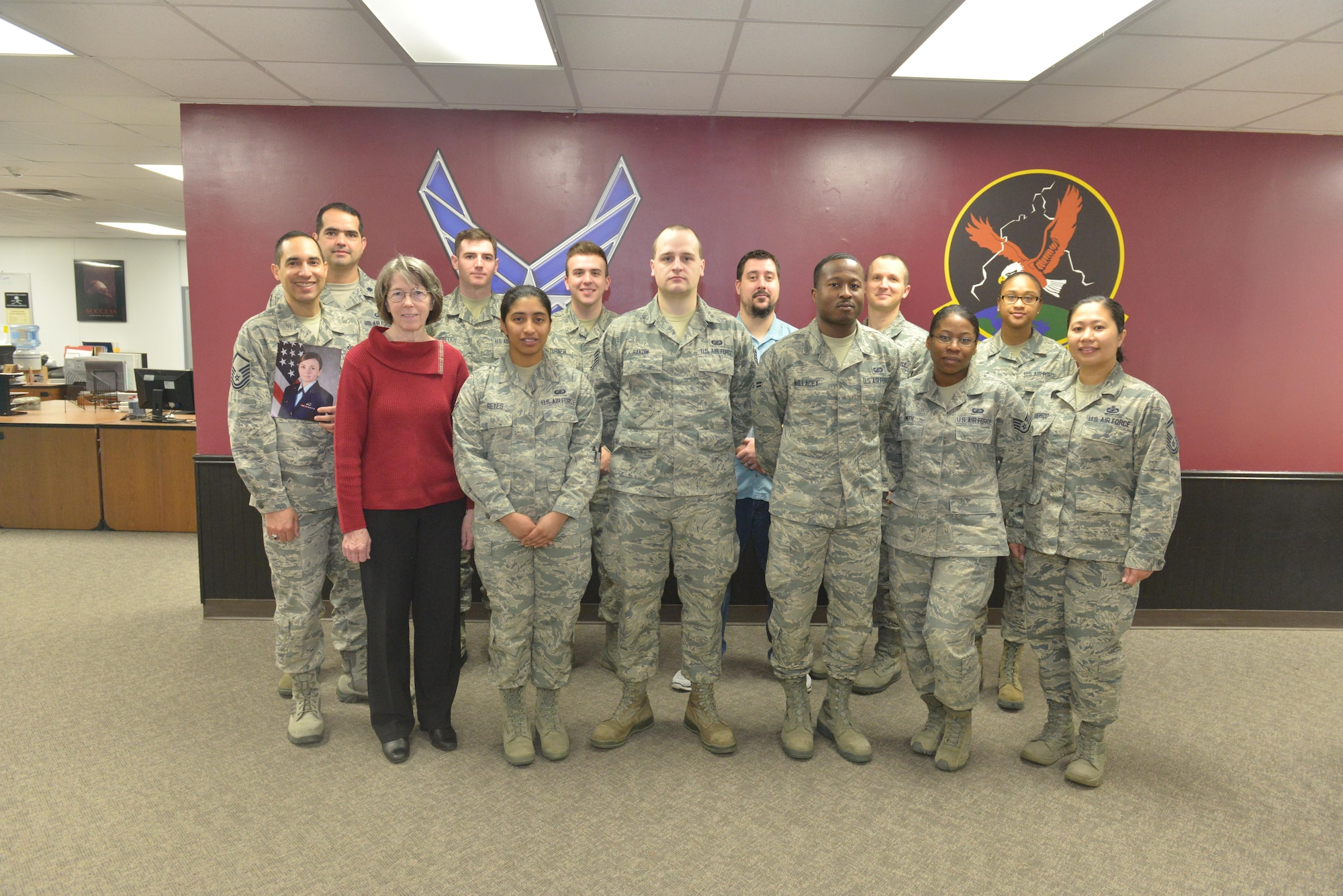 The 5th Comptroller Squadron stands for a group photo at Minot Air Force Base, N.D., April 4, 2017. The 5th CPTS recently took home the title of the Air Force Financial Services Office of the Year. (U.S. Air Force photo/Airman 1st Class Jessica Weissman)