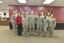 The 5th Comptroller Squadron stands for a group photo at Minot Air Force Base, N.D., April 4, 2017. The 5th CPTS recently took home the title of the Air Force Financial Services Office of the Year. (U.S. Air Force photo/Airman 1st Class Jessica Weissman)