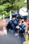 Senior Airman Roman Vizone, ceremonial guardsman with the Wright-Patterson Air Force Base Honor Guard, stands at port arms as Airman 1st Class Izan Velazquez places the American Flag in its stand at the 75th Anniversary memorial ceremony of the Doolittle Tokyo Raid, April 18, 2017 at the National Museum of the United States Air Force in Dayton, Ohio. Attending the ceremony was Chief of the Staff of the Air Force, Gen. David L. Goldfein, Lt. Col. (Ret.) Richard E. Cole, the sole surviving member of the Doolittle Raiders, and Jeff Thatcher, the son of Doolittle Raider Staff Sgt. David Thatcher, who passed in June 2016. (U.S. Air Force Photo/Wesley Farnsworth)