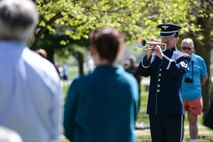 Master Sgt. Mike Richter, a musician with Wright Brass from the Air Force Band of Flight, plays taps at the conclusion of the 75th Anniversary memorial ceremony of the Doolittle Tokyo Raid, April 18, 2017 at the National Museum of the United States Air Force in Dayton, Ohio. Attending the ceremony was Lt. Col. (Ret.) Richard E. Cole, the sole surviving member of the Doolittle Raiders, and Jeff Thatcher, the son of Doolittle Raider Staff Sgt. David Thatcher, who passed in June 2016. (U.S. Air Force Photo/Wesley Farnsworth)