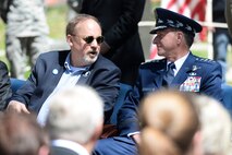 Chief of Staff of the Air Force, Gen. David L. Goldfein, talks to Jeff Thatcher (left), the son of Doolittle Raider Staff Sgt. David Thatcher, who passed in June 2016, during the 75th Anniversary of the Doolittle Raid Memorial Ceremony at the National Museum of the United States Air Force, April 18, 2017. Also attending was Lt. Col. (Ret.) Richard E. Cole, the sole surviving member of the Doolittle Raiders. (U.S. Air Force Photo/ Wesley Farnsworth)