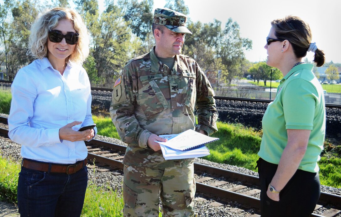 Col. David Ray, Sacramento District commander; Tambour Eller, right, deputy district engineer for project management; and Elvan Childs, project manager, left, take part in a March 17 site visit along the Marysville Ring Levee.
