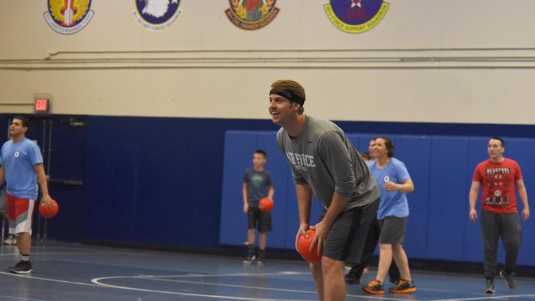 Caleb Guarino, 50th Operations Support Squadron, scouts the opposing team during the annual Sexual Assault Awareness and Prevention Month Dodgeball Tournament at Schriever Air Force Base, Colorado, Friday, April 14, 2017. His team, the 21st Space Wing Family Advocacy Program, won the tournament beating out the 50th Security Forces Squadron. 