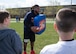 Brandon Bolden, a running back for the New England Patriots, speaks to Hanscom children attending a free youth football and cheer clinic on base April 18. The football and cheer clinics, which are part of the NFL’s Play 60 program and the Patriots’ Football for You program, were open to children ages 7 to 14 and 174 participated in the event. (U.S. Air Force photo by Mark Herlihy)