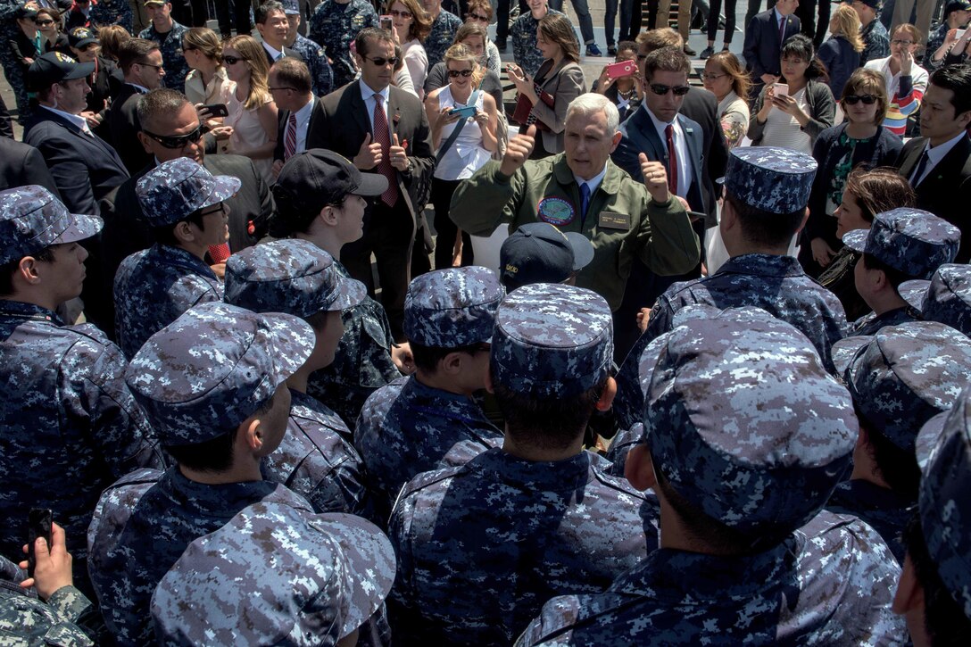 Vice President Mike Pence meets Japanese service members on the flight deck of the USS Ronald Reagan in Yokosuka, Japan, April 19, 2017. Navy photo by Petty Officer 2nd Class Nathan Burke