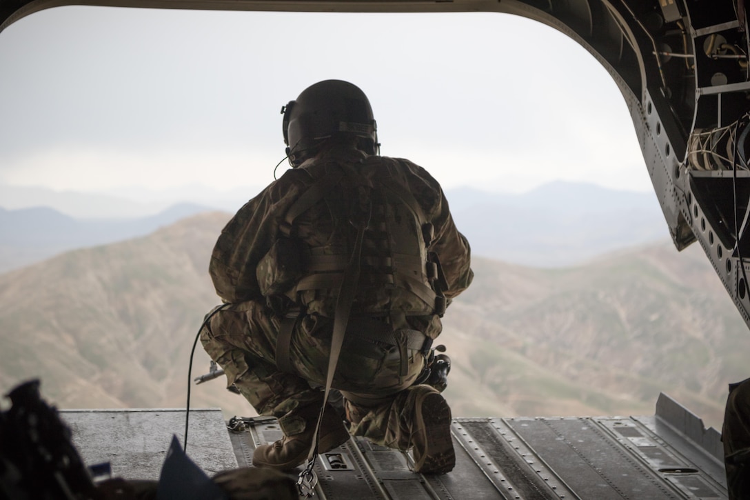 A U.S. Army CH-47 helicopter crew chief assigned to Task Force Flying Dragons, 16th Combat Aviation Brigade, 7th Infantry Division scans below while flying near Jalalabad, Afghanistan, April 5, 2017. The Flying Dragons are preparing to assume their mission in support of Operation Freedom’s Sentinel and Resolute Support Mission.