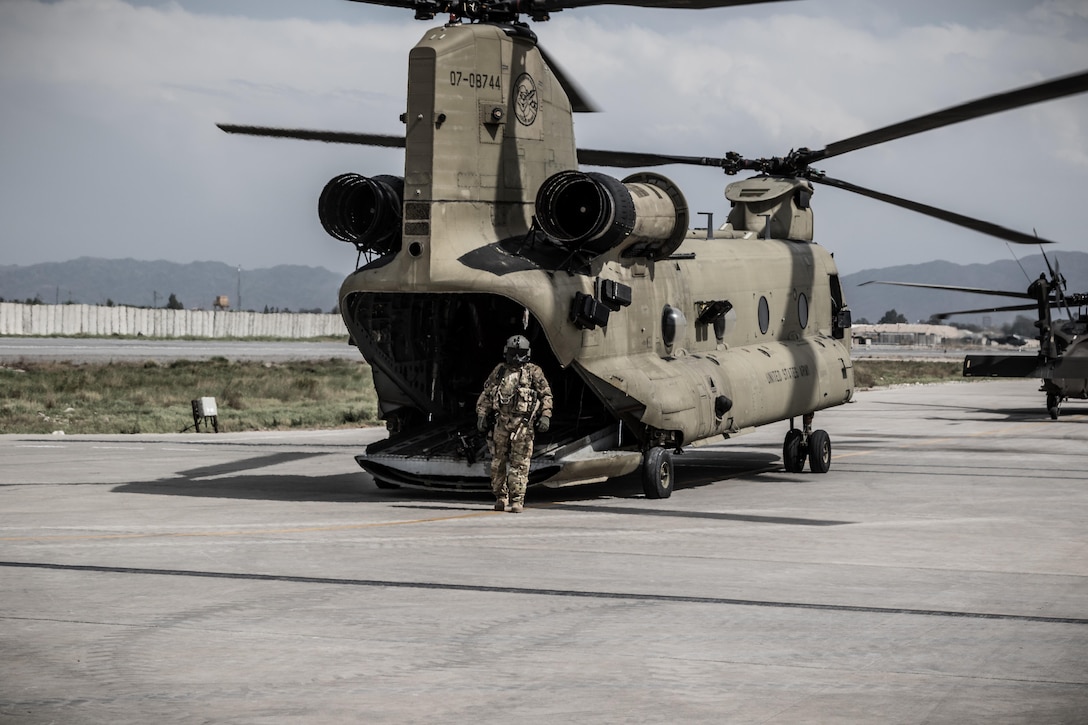 A U.S. Army CH-47 helicopter crew chief assigned to Task Force Flying Dragons, 16th Combat Aviation Brigade, 7th Infantry Division prepares for a flight at Operating Base Fenty, Afghanistan, April 5, 2017. The Flying Dragons are preparing to assume their mission in support of Operation Freedom’s Sentinel and Resolute Support Mission.