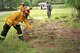 U.S. Airmen assigned to the 20th Civil Engineer Squadron fire department remove ground debris during a simulated wildfire training at Shaw Air Force Base, S.C., April 19, 2017. As part of mandatory certifications, firefighters are required to practice proper wildfire safety procedures to include, protecting people and property in the surrounding area. (U.S. Air Force photo by Airman 1st Class Christopher Maldonado)