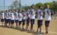 Wounded Warrior Amputee Softball Team members stand during the playing of the national anthem during the WWAST game against the Newport News police and fire departments in Newport News, Va., April 15, 2017. The WWAST challenged the Newport News first responders to a seven-inning game to raise awareness for wounded service members. (U.S. Air Force photo/Airman 1st Class Kaylee Dubois)
