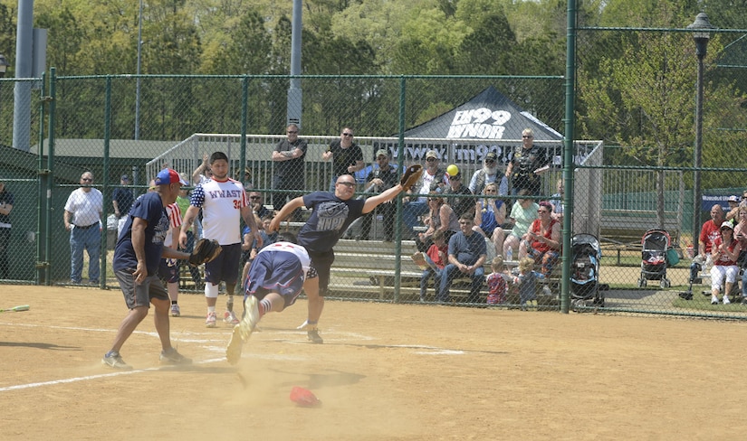 A Wounded Warrior Amputee Softball Team member slides into the home plate during the WWAST softball game against the Newport News police and fire departments in Newport News, Va., April 15, 2017. The WWAST players also host a kids’ softball camp to educate and inspire children who face many of the same challenges they do. (U.S. Air Force photo/Airman 1st Class Kaylee Dubois)