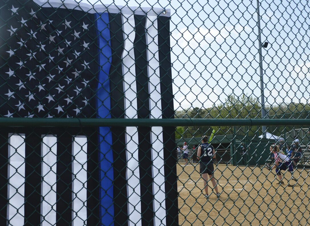 A Newport News police officer prepares to bat during the Wounded Warrior Amputee Softball Team vs. Newport News police and fire department game in Newport News, Va., April 15, 2017. Having once served their country, the WWAST athletes continue to serve as role models across the nation, inspiring hope in the face of adversity. 
 (U.S. Air Force photo/Airman 1st Class Kaylee Dubois)