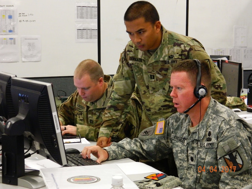 303rd Maneuver Enhancement Brigade Soldiers - Cpt. Thomas Hacker (left), Cpt. Allen Gervico (middle), and Lt. Col. Gordon Knowles (right), prepare for a commander’s update brief during their participation in a warfighter exercise (WFX) hosted by the 25th Infantry Division at Mission Training Complex – Hawaii, Schofield Barracks, April 4, 2017. The exercise ran from April 3-12. It was the first time the 303rd MEB participated in a WFX since its activation just 4 years ago. As the only MEB in the Pacific region, the WFX enhances training to provide for proficiency in the Brigade’s full mission capabilities on protection and freedom of maneuver within a battle area of operation.