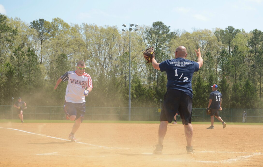 Retired U.S. Marine Corps Lance Cpl. Kyle Earl, Wounded Warrior Amputee Softball Team member, runs to home plate during the WWAST game against the Newport News police and fire departments in Newport News, Va., April 15, 2017. Each team member hopes to be an example to others of the sacrifices of military members. (U.S. Air Force photo/Airman 1st Class Kaylee Dubois)