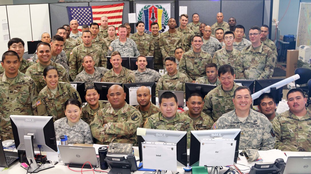 303rd Maneuver Enhancement Brigade Soldiers and Soldiers of the 25th Infantry Division, pose for a group photo to record their success as a team while participating in a warfighter exercise (WFX) ) hosted by the 25th Infantry Division at Mission Training Complex – Hawaii, Schofield Barracks, April 6, 2017. The exercise ran from April 3-12. It was the first time the 303rd MEB participated in a WFX since its activation just 4 years ago. The warfighter exercise provided invaluable practice for Soldiers of the 303rd MEB as well as an opportunity to work shoulder-to-shoulder with 25th ID Soldiers.