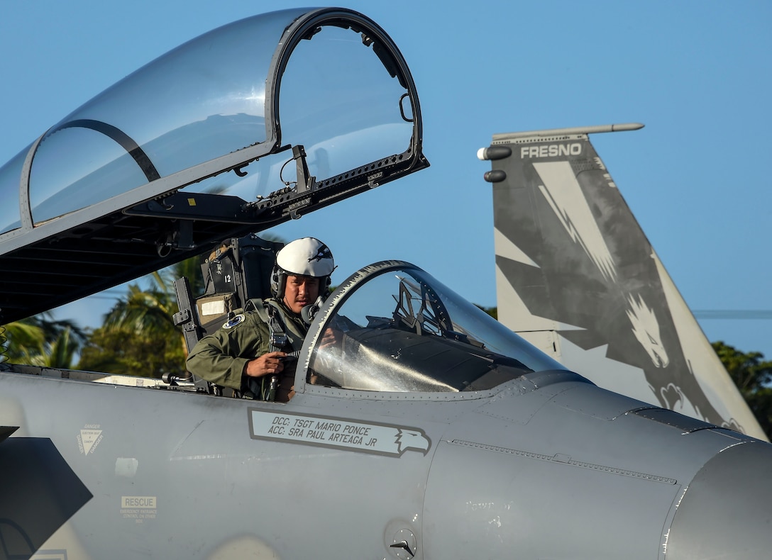 U.S. Air Force Capt. Christopher Lacroix, 194th Fighter Squadron pilot, California Air National Guard, secures his flight gear on an F-15C Eagle prior to take-off April 1, 2017 for Sentry Aloha 17-03. Sentry Aloha is an Air Guard led exercise that provides a current, realistic, and integrated training environment to the U.S. Air Force and joint partners. (Air National Guard photo by Senior Master Sgt. Chris Drudge)