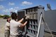 U.S. Air Force Staff Sgt. Raymundo Fernandez (right) and Tech. Sgt. Michael Quintanilla, both from the 144th Maintenance Squadron, California Air National Guard, pull fully loaded chaff boxes to install in the F-15C Eagle after the morning sortie during Sentry Aloha 17-03 April 1, 2017. Sentry Aloha is an Air Guard led exercise that provides a current, realistic, and integrated training environment to the U.S. Air Force and joint partners. (Air National Guard photo by Senior Master Sgt. Chris Drudge)