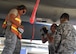 U.S. Air Force Tech. Sgt. Melissa Hernandez (left) observes Staff Sgts. Orion Wash and Jesus Napoles Calderon, all from the 144th Aircraft Maintenance Squadron weapons branch, install a fully loaded chaff box in the F-15C Eagle after the morning sortie during Sentry Aloha 17-03 April 1, 2017. Sentry Aloha is an Air Guard led exercise that provides a current, realistic, and integrated training environment to the U.S. Air Force and joint partners. (Air National Guard photo by Senior Master Sgt. Chris Drudge)