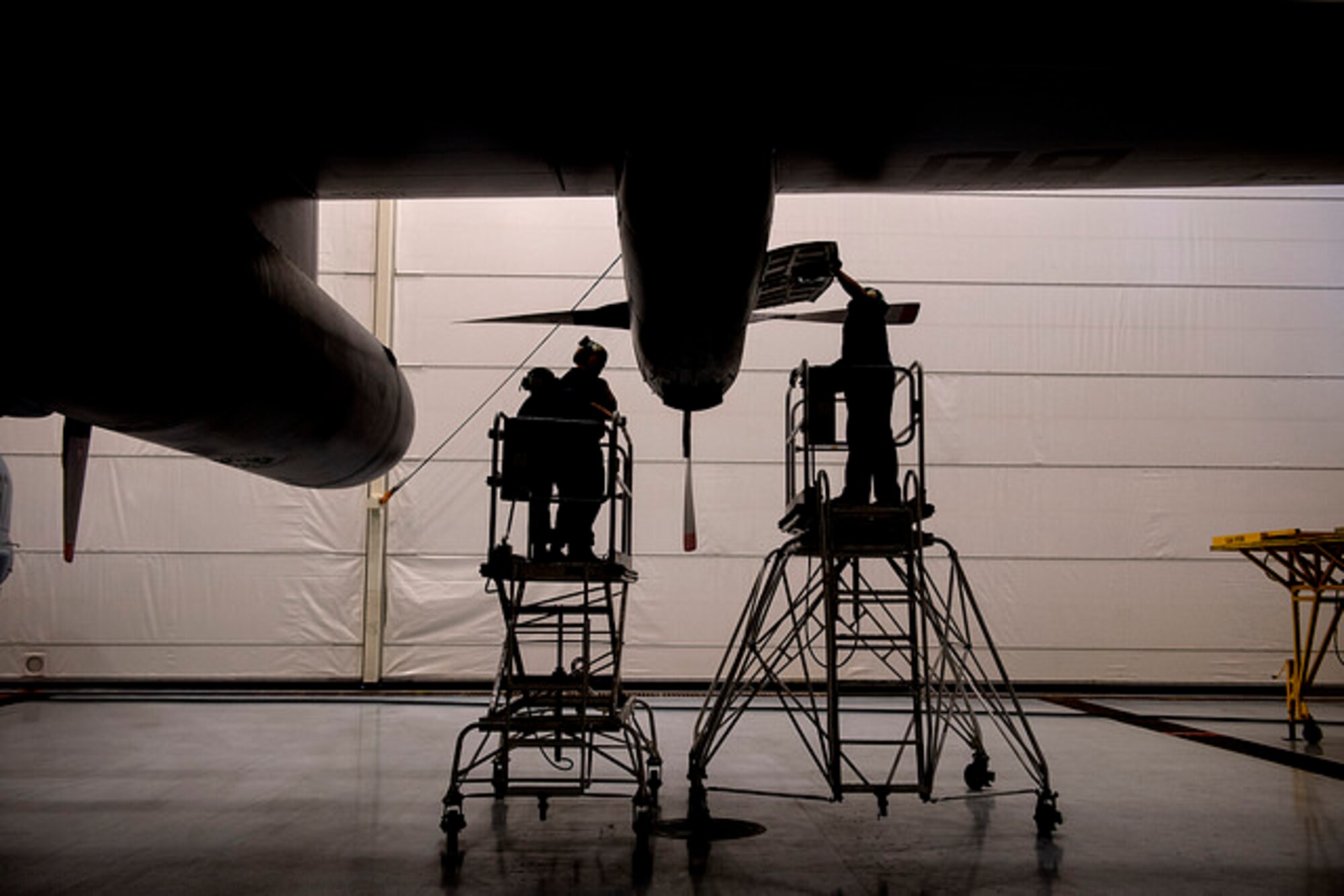 Sailors from Fleet Logistics Squadron 64 examine an engine of a C-130T Logistics Support Aircraft at Joint Base McGuire-Dix-Lakehurst, N.J. April 7. The Sailors perform daily and 35 day inspections. 