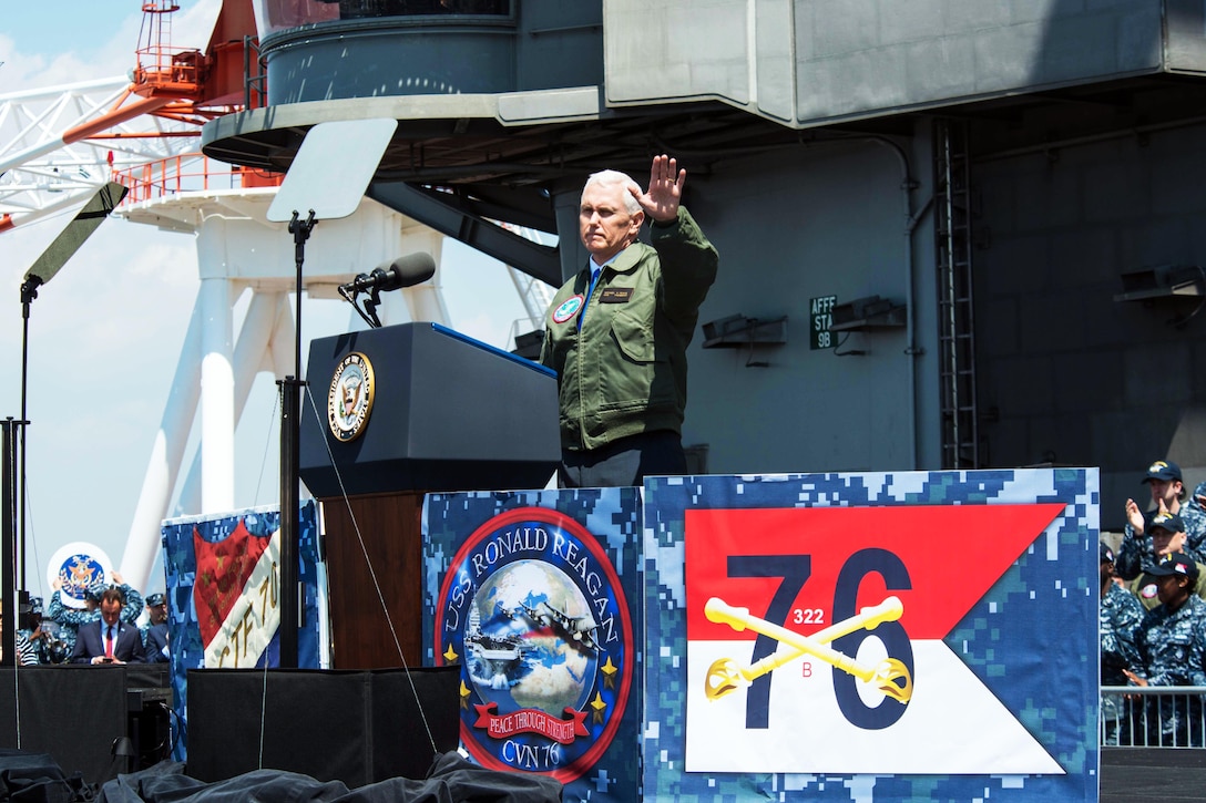 Vice President Mike Pence waves to service members on the flight deck of the USS Ronald Reagan in Yokosuka, Japan, April 19, 2017. Navy photo by Petty Officer 3rd Class James Lee