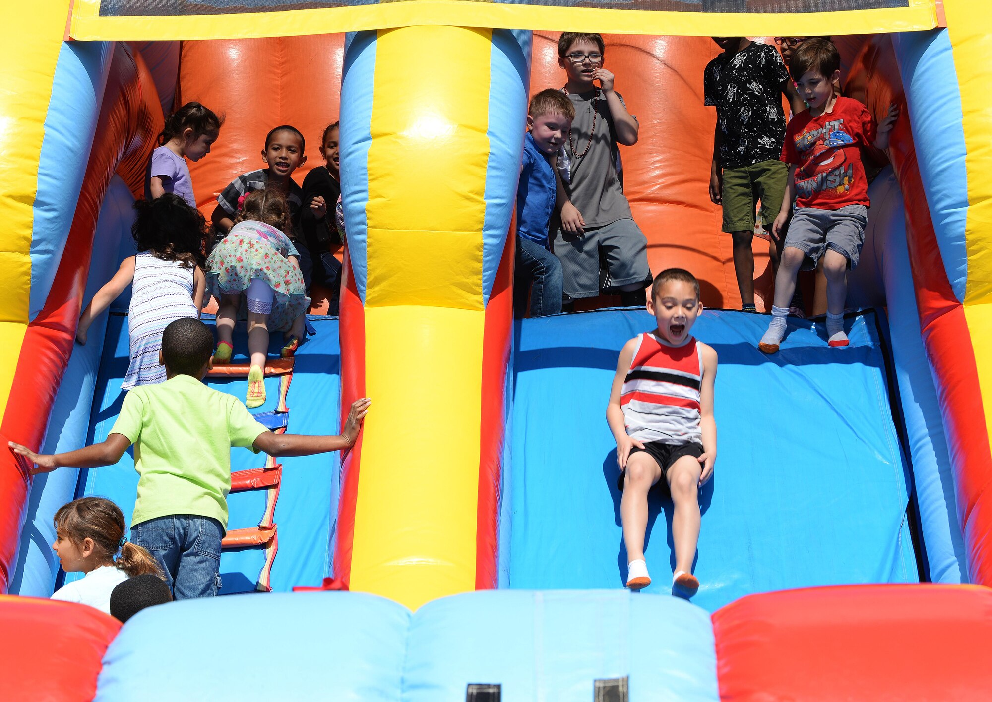 Team Scott families partake in many fun activities at the Egg Hunt Egg-Stravaganza, hosted by the 375th Force Support Squadron, Scott Air Force Base, Ill., April 15, 2017. The free event at the Scott AFB Youth Center included egg hunts for different age groups, Easter bunny, bounce houses, face painting, prizes, food from the USO, sack races, and a Security Forces vehicle display. (U.S. Air Force photo by Senior Airman Erica Fowler)