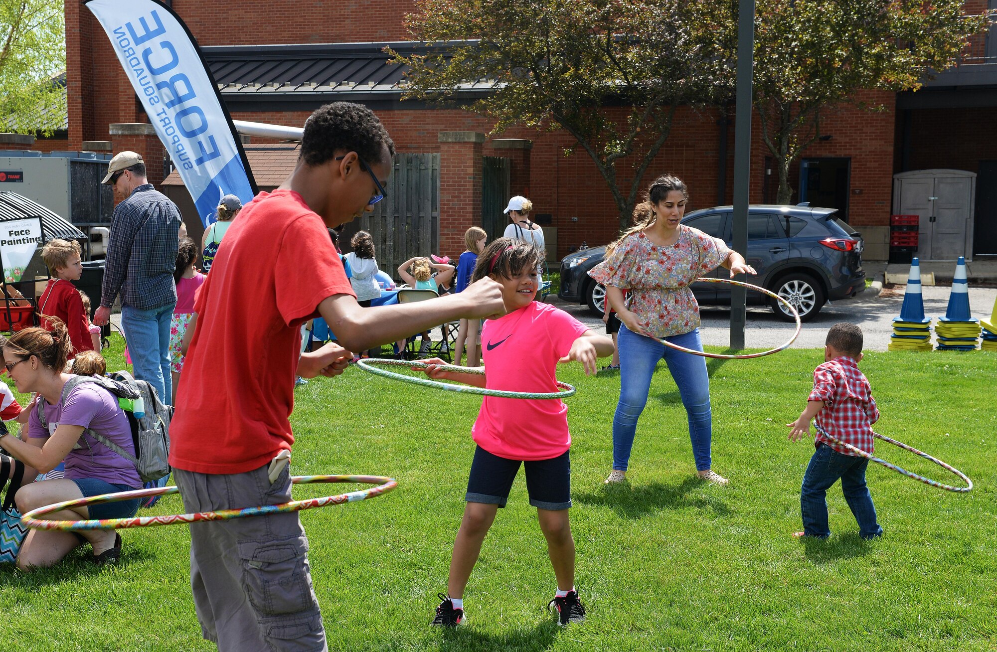 Team Scott families partake in many fun activities at the Egg Hunt Egg-Stravaganza, hosted by the 375th Force Support Squadron, Scott Air Force Base, Ill., April 15, 2017. The free event at the Scott AFB Youth Center included egg hunts for different age groups, Easter bunny, bounce houses, face painting, prizes, food from the USO, sack races, and a Security Forces vehicle display. (U.S. Air Force photo by Senior Airman Erica Fowler)