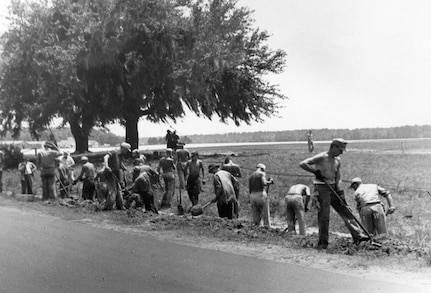 German Prisoner's of War work along the roadside near the Charleston Army Airfield. 