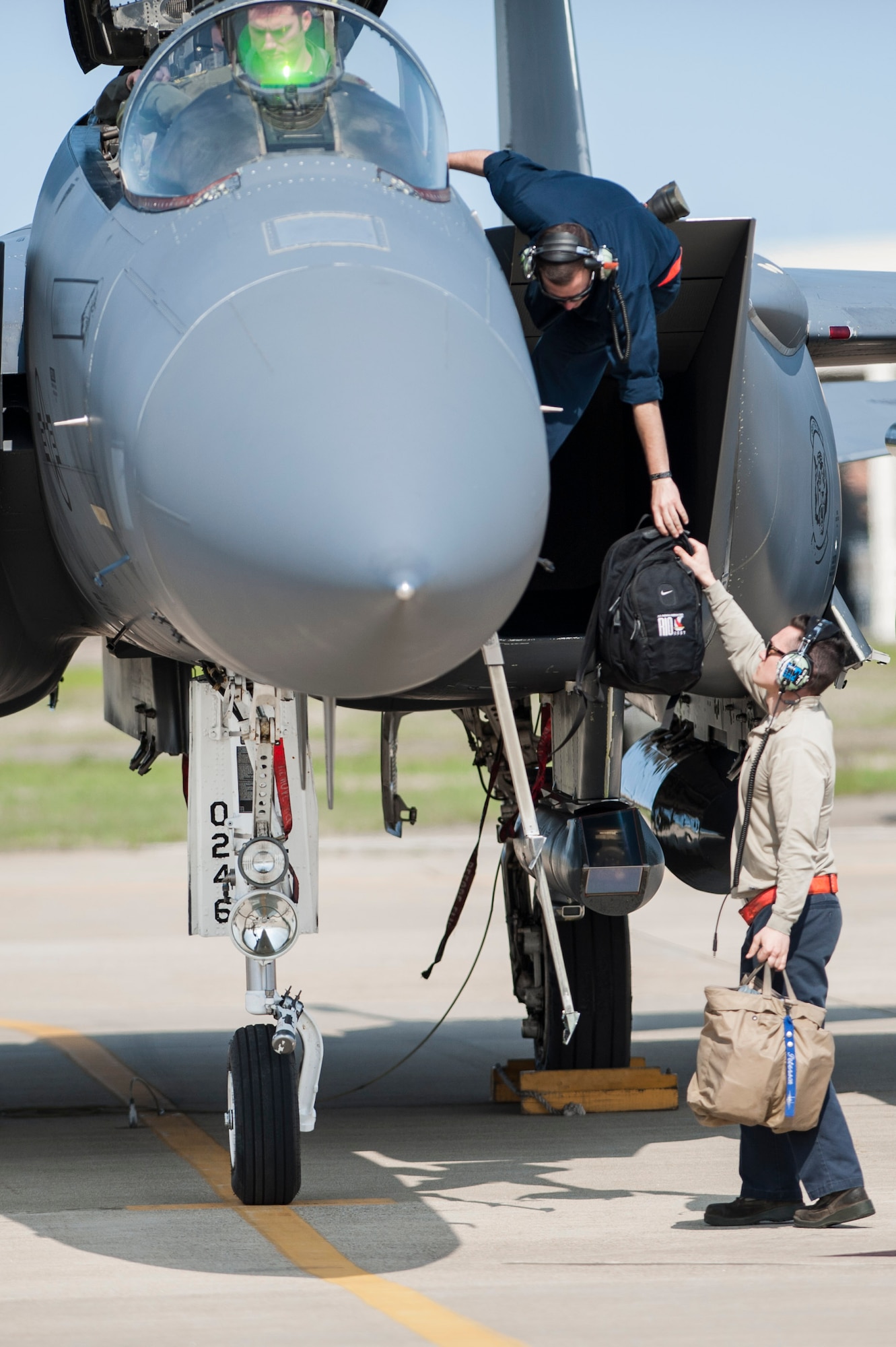 U.S. Air Force Airmen assigned to the 366th Maintenance Group at Mountain Home Air Force Base, Idaho, assists an F-15E Strike Eagle pilot at Joint Base Langley-Eustis, Va., April 14, 2017. The U.S. Air Force F-15E Strike Eagles and T-38 Talons played the roles of adversary aircraft during the ATLANTIC TRIDENT 17 exercise. (U.S. Air Force photo/Airman 1st Class Tristan Biese)