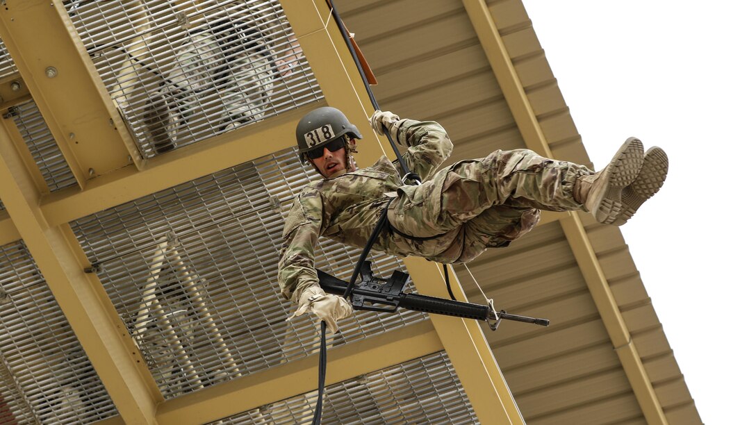 Army Spc. Dylan Gustaitis rappels off a tower as part of the air assault course at Camp Buehring, Kuwait, April 12, 2017. The 12-day class allows U.S. military personnel to become air assault qualified while deployed outside the continental United States. Army photo by Sgt. Tom Wade