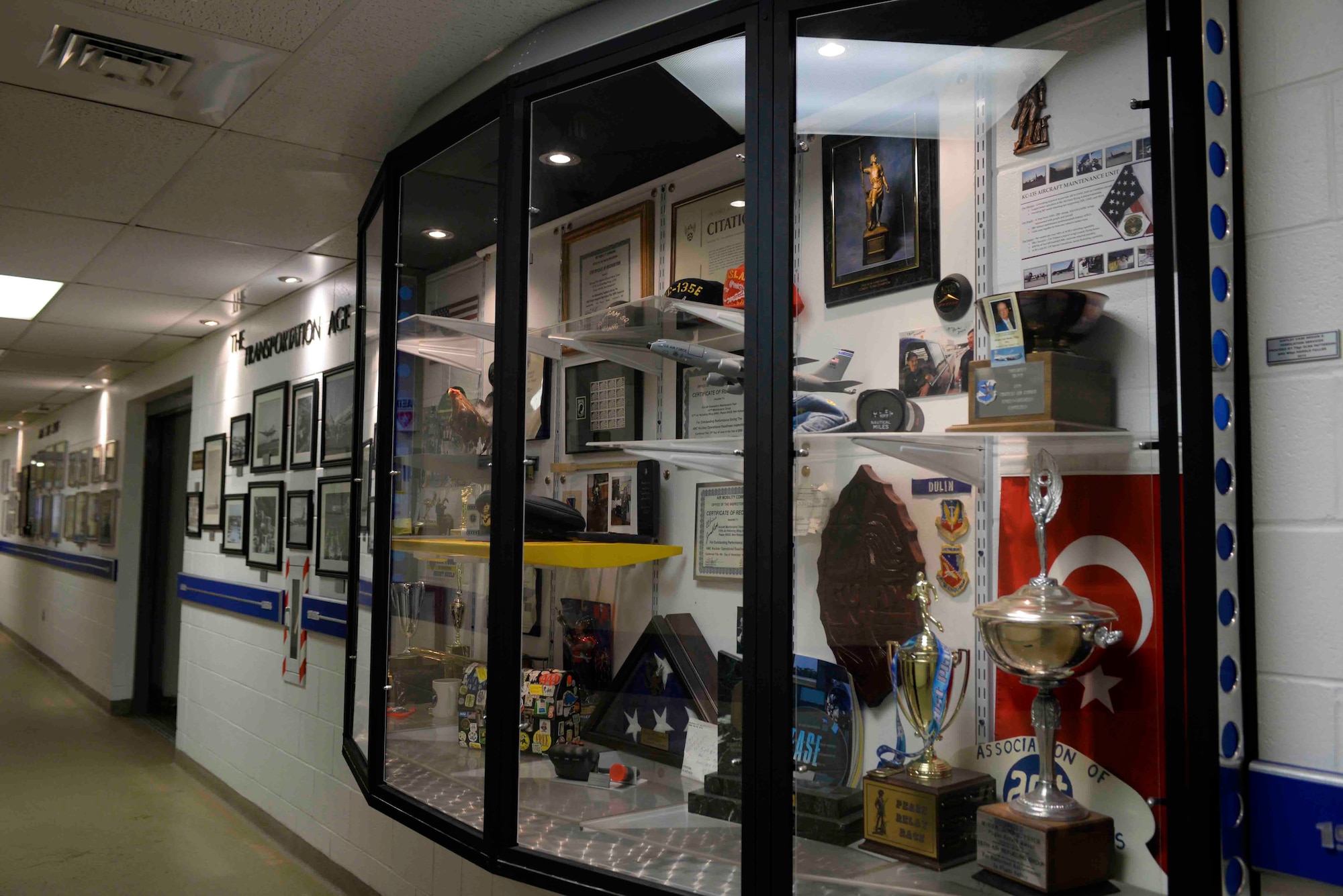 The 157th Maintenance Group on Pease Air National Guard Base, N.H., displays their history and heritage in the main hallway of building 254. The display was created and built by retired Master Sgt. Harold Fuller, past supervisor from the 157th MXG. (U.S. Air National Guard photo by Airman Victoria Nelson)