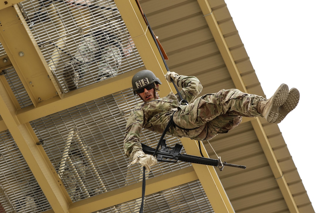 Army Spc. Dylan Gustaitis rappels off a tower as part of the air assault course at Camp Buehring, Kuwait, April 12, 2017. The 12-day class allows U.S. military personnel to become air assault qualified while deployed outside the continental United States. Army photo by Sgt. Tom Wade