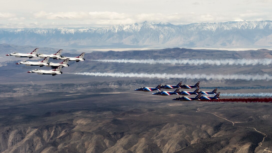 The Air Force Thunderbirds and Patrouille de France fly together over Death Valley, Calif., April 17, 2017. The Thunderbirds and Patrouille de France are two of the world's oldest aerial demonstration teams. Air Force photo by Tech. Sgt. Christopher Boitz