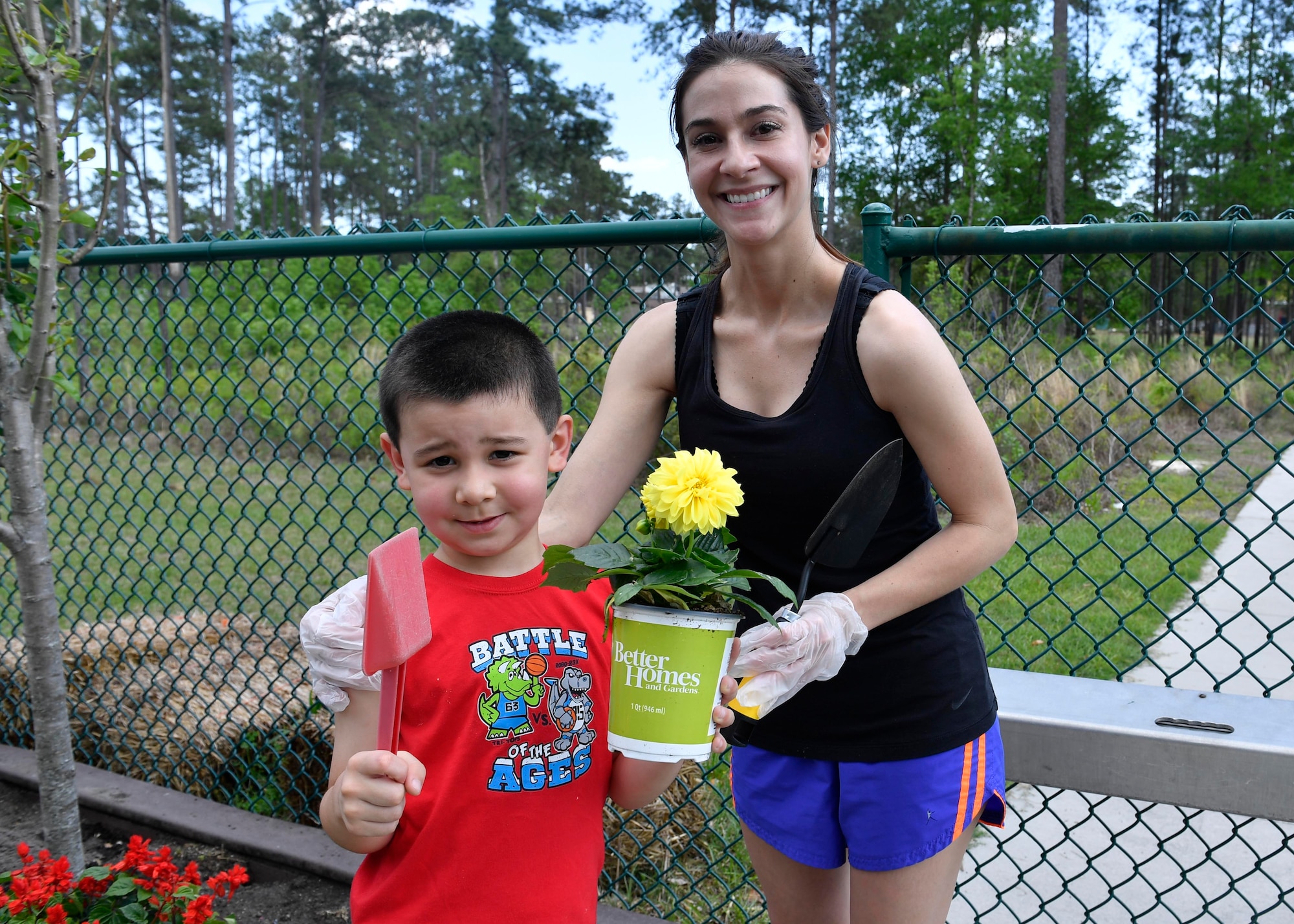 Kelley Lamberth and her son Ryan prepare to plant flowers at the Joint Base Charleston-Weapons Station Child Development Center, April 13, 2017. April was named Month of the Military Child by former Defense Secretary Casper Weinberger in 1989 to applaud military children for their daily sacrifices and the challenges they have overcome. The WS CDC is celebrating Month of the Military Child by hosting Wacky Hat Wednesdays, Purple Up! Fridays and planting gardens with parents and students.