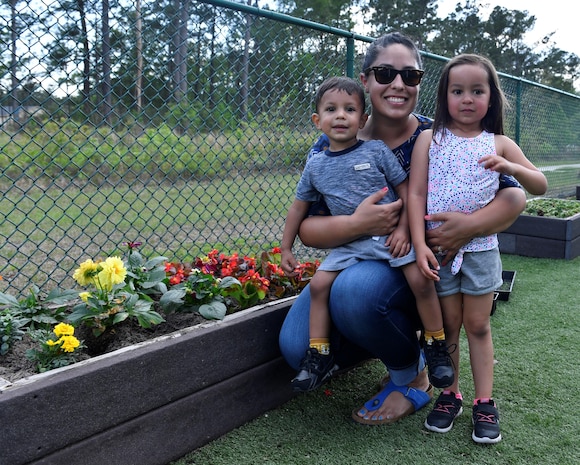 Danielle Hallquist, a military spouse, poses for a photo with her kids, Luna and Noah, at the Joint Base Charleston-Weapons Station Child Development Center, April 13, 2017. April was named Month of the Military Child by former Defense Secretary Casper Weinberger in 1989 to applaud military children for their daily sacrifices and the challenges they have overcome. The WS CDC is celebrating Month of the Military Child by hosting Wacky Hat Wednesdays, Purple Up! Fridays and planting gardens with parents and students.