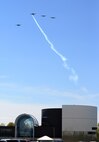 Four B-25 Mitchell bombers fly over the National Museum of the United States Air Force at Wright-Patterson Air Force Base, Ohio, April 18, 2017, in a missing-man formation on the 75th anniversary of the Doolittle Raid on Japan. The flyover marked the start of a memorial service commemorating the raid. (U.S. Air Force photo by R.J. Oriez)