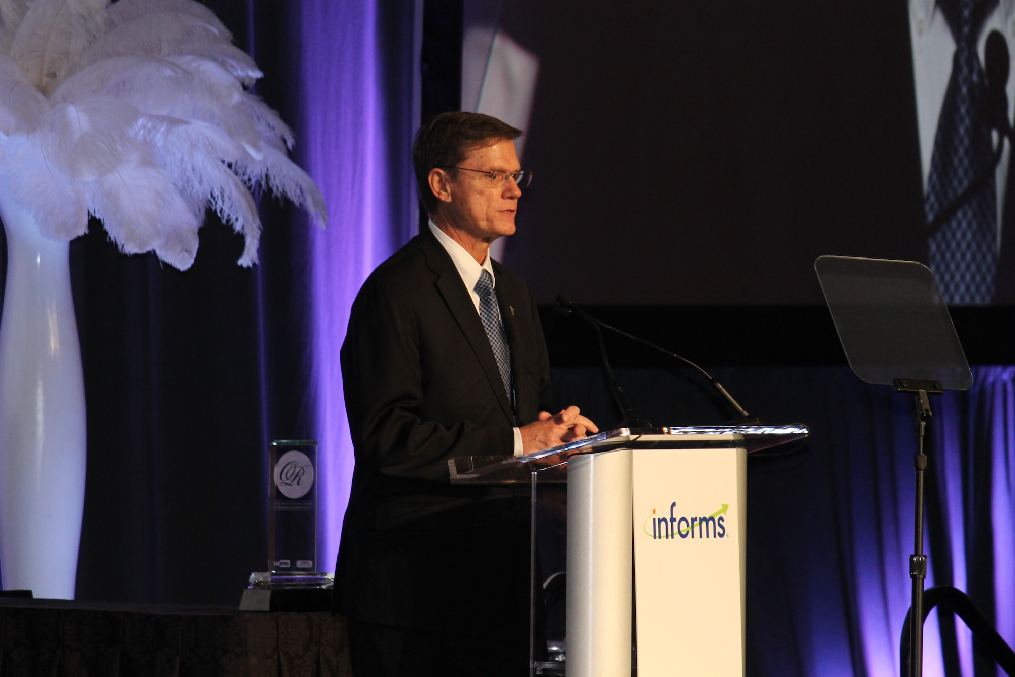 Kevin Williams, the director of Air Force studies, analyses and assessments, speaks after accepting the INFORMS Prize award on behalf of the Air Force Studies, Analysis and Assessments directorate April 3, 2017, at a gala in Las Vegas, Nev. The award is given to organizations that have repeatedly applied the principles of operations research in pioneering, carried, novel and lasting ways. (Courtesy photo)