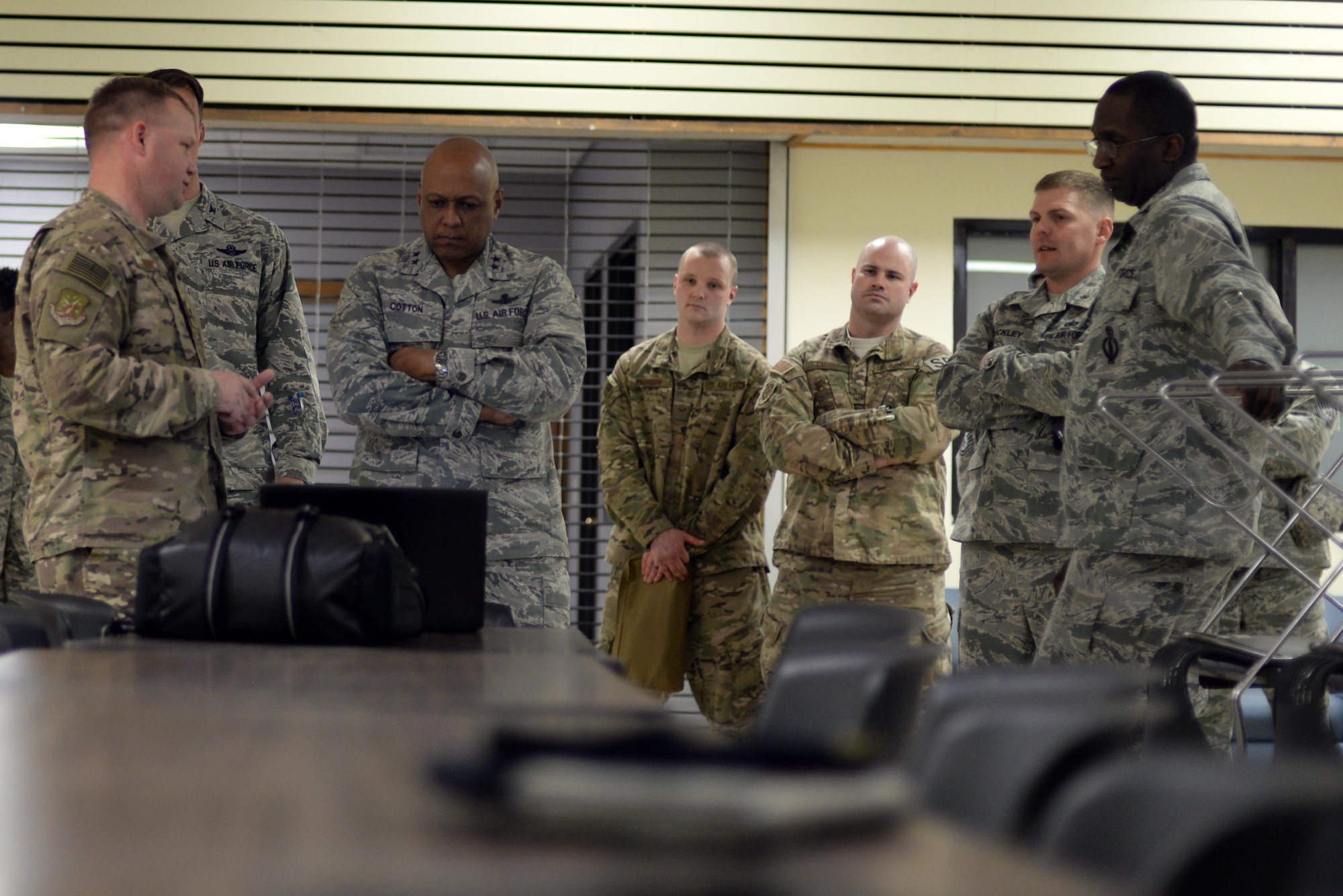 Maj. Gen. Anthony Cotton, 20th Air Force commander, and Airmen watch a training video at Minot Air Force Base, N.D., April 28, 2017. Cotton visited the 91st Security Forces Squadron’s training building and a missile alert facility during his tour of the base. (U.S. Air Force photo/Airman 1st Class Austin M. Thomas)