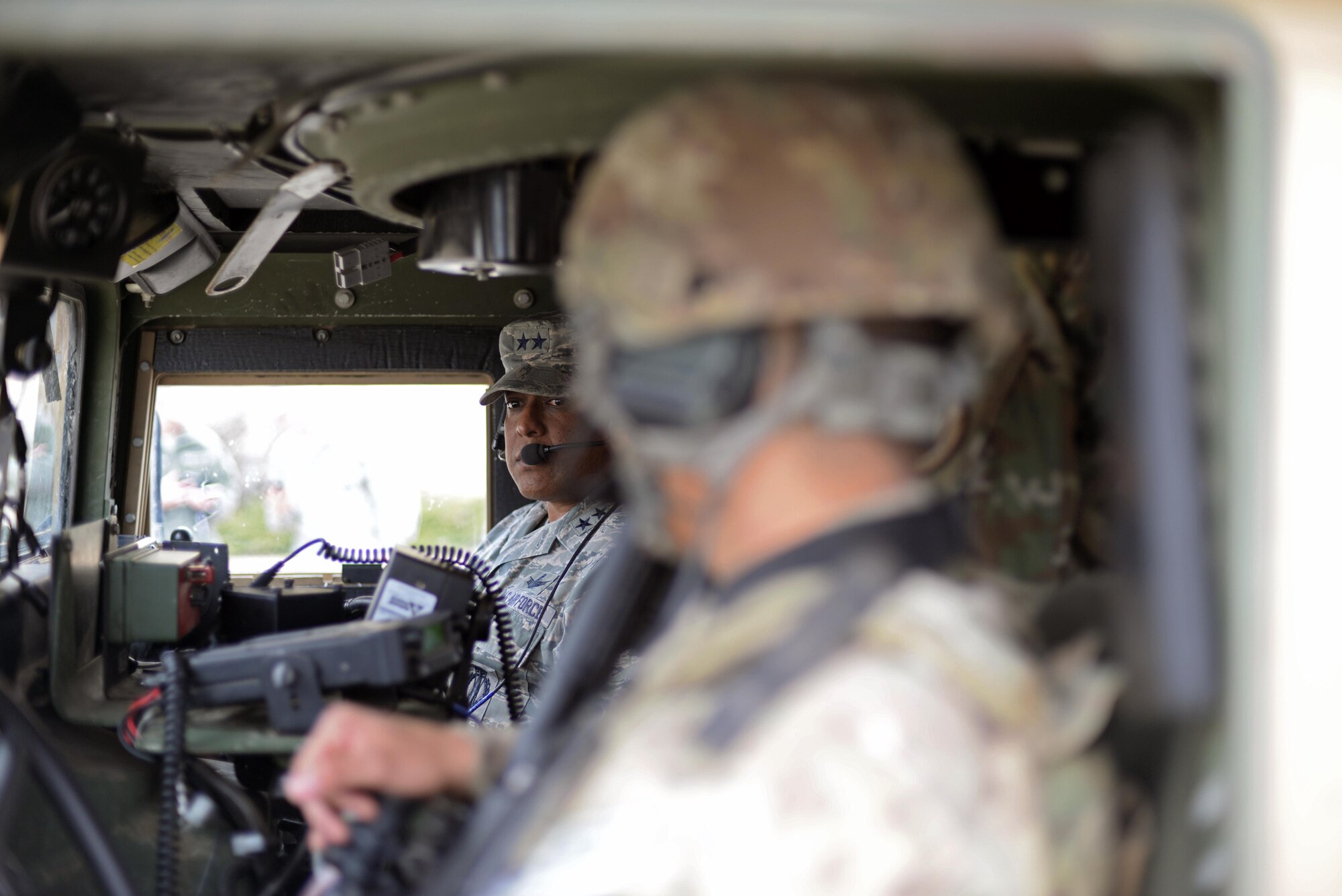 Maj. Gen. Anthony Cotton, 20th Air Force commander, speaks with an Airman inside a Humvee at Minot Air Force Base, N.D., April 28, 2017. Cotton visited the 91st Security Forces Squadron’s training building and a missile alert facility during his tour of the base. (U.S. Air Force photo/Airman 1st Class Austin M. Thomas)
