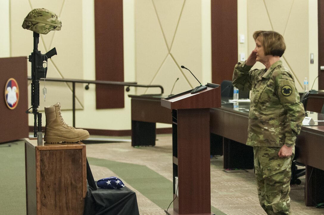 Maj. Gen. Megan P. Tatu, Chief of Staff, U.S. Army Reserve Command, renders a final salute as USARC Soldiers and civilians remembered Maj. Gen. Franciso A. Espaillat during a memorial ceremony at the U.S. Army Reserve Command headquarters, April 19, 2017, at Fort Bragg, N.C. Espaillat, 56, from New York City, was slated to become the next U.S. Army Reserve Command chief of staff. He previously served as the commanding general of the 143rd Sustainment Command (Expeditionary), in Orlando, Fla. Espaillat died April 7, 2017, at Fort Bragg. (U.S. Army photo by Timothy L. Hale/Released)
