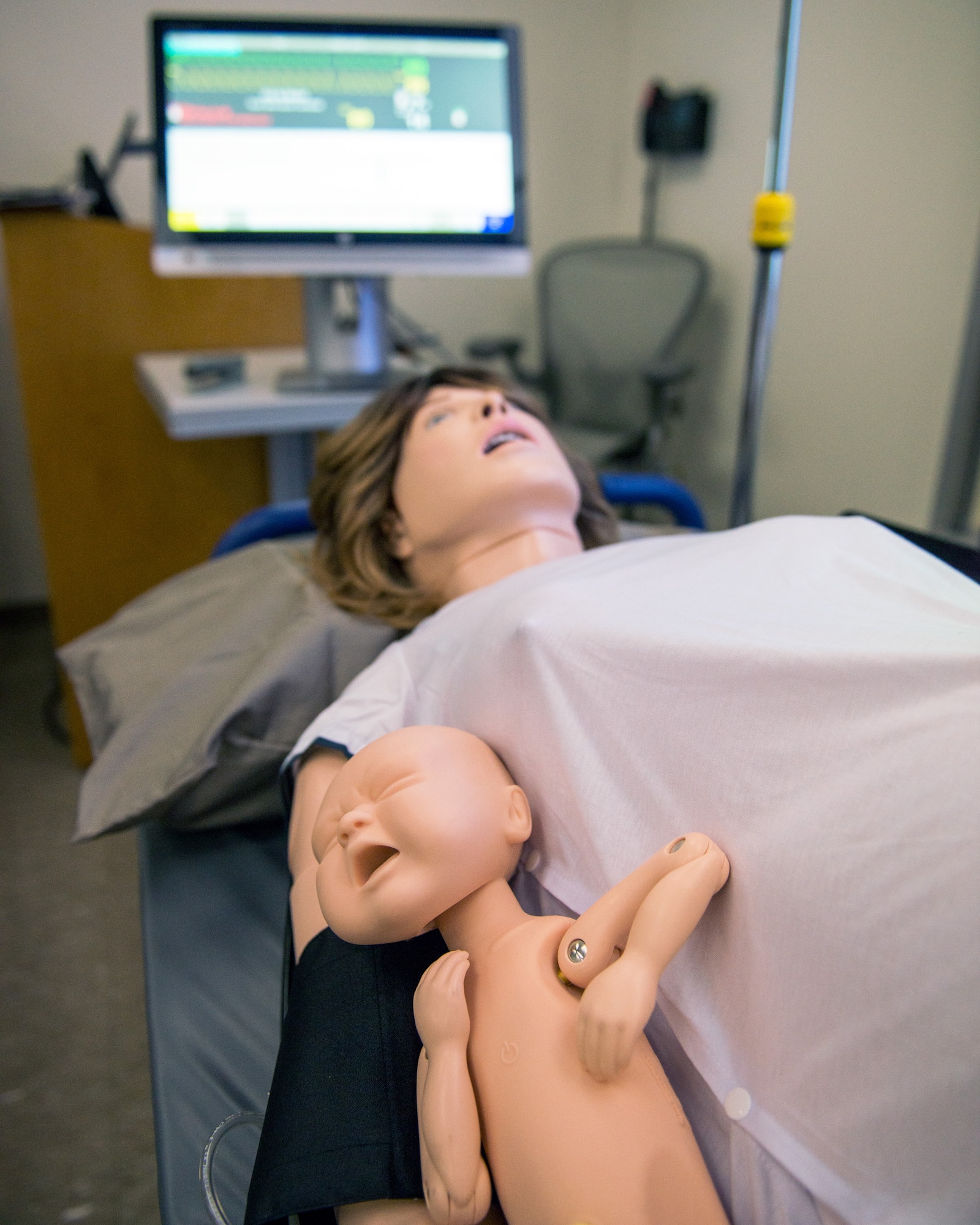 Medical staff conduct training on the new Complicated OB Emergency Simulator at Travis Air Force Base, Calif., April 10, 2017. Travis has been selected by the Defense Health Agency as one of five installations within DOD to be a pilot base for the new system. The system will provide a standardized platform for training for all levels of clinical staff to promote standardization on patient safety. (U.S. Air Force photo by Louis Briscese)