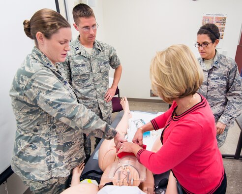 Medical staff conduct training on the new Complicated OB Emergency Simulator at Travis Air Force Base, Calif., April 10, 2017. Travis has been selected by the Defense Health Agency as one of five installations within DOD to be a pilot base for the new system. The system will provide a standardized platform for training for all levels of clinical staff to promote standardization on patient safety. (U.S. Air Force photo by Louis Briscese)