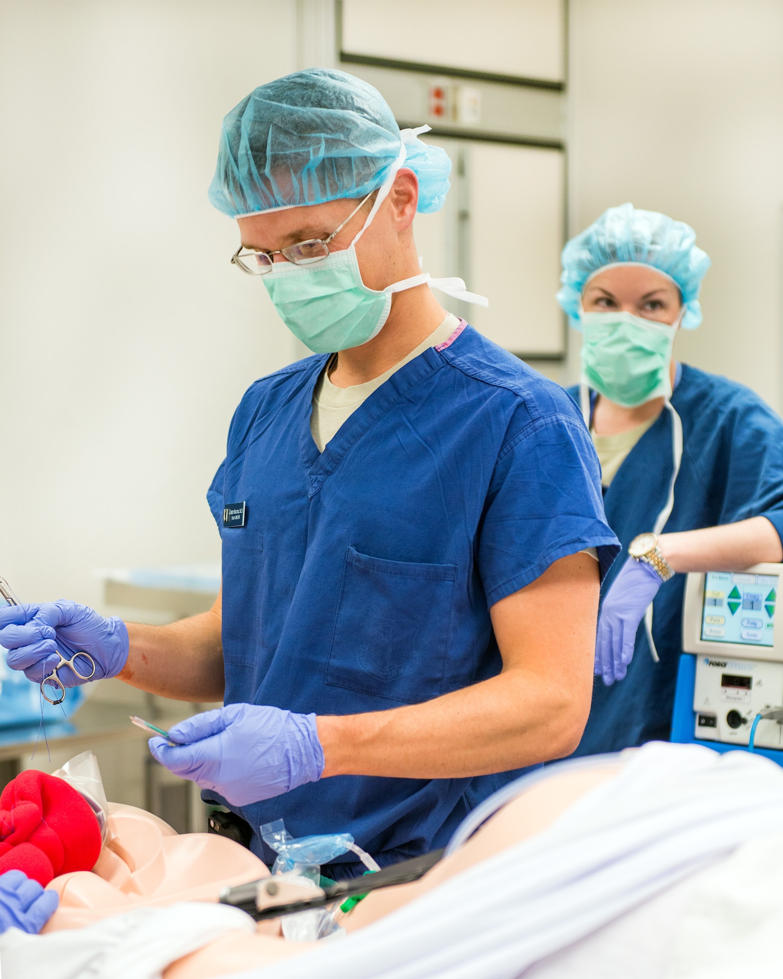 Medical staff conduct training on the new Complicated OB Emergency Simulator at Travis Air Force Base, Calif., April 11, 2017. Travis has been selected by the Defense Health Agency as one of five installations within DOD to be a pilot base for the new system. The system will provide a standardized platform for training for all levels of clinical staff to promote standardization on patient safety. (U.S. Air Force photo by Louis Briscese)