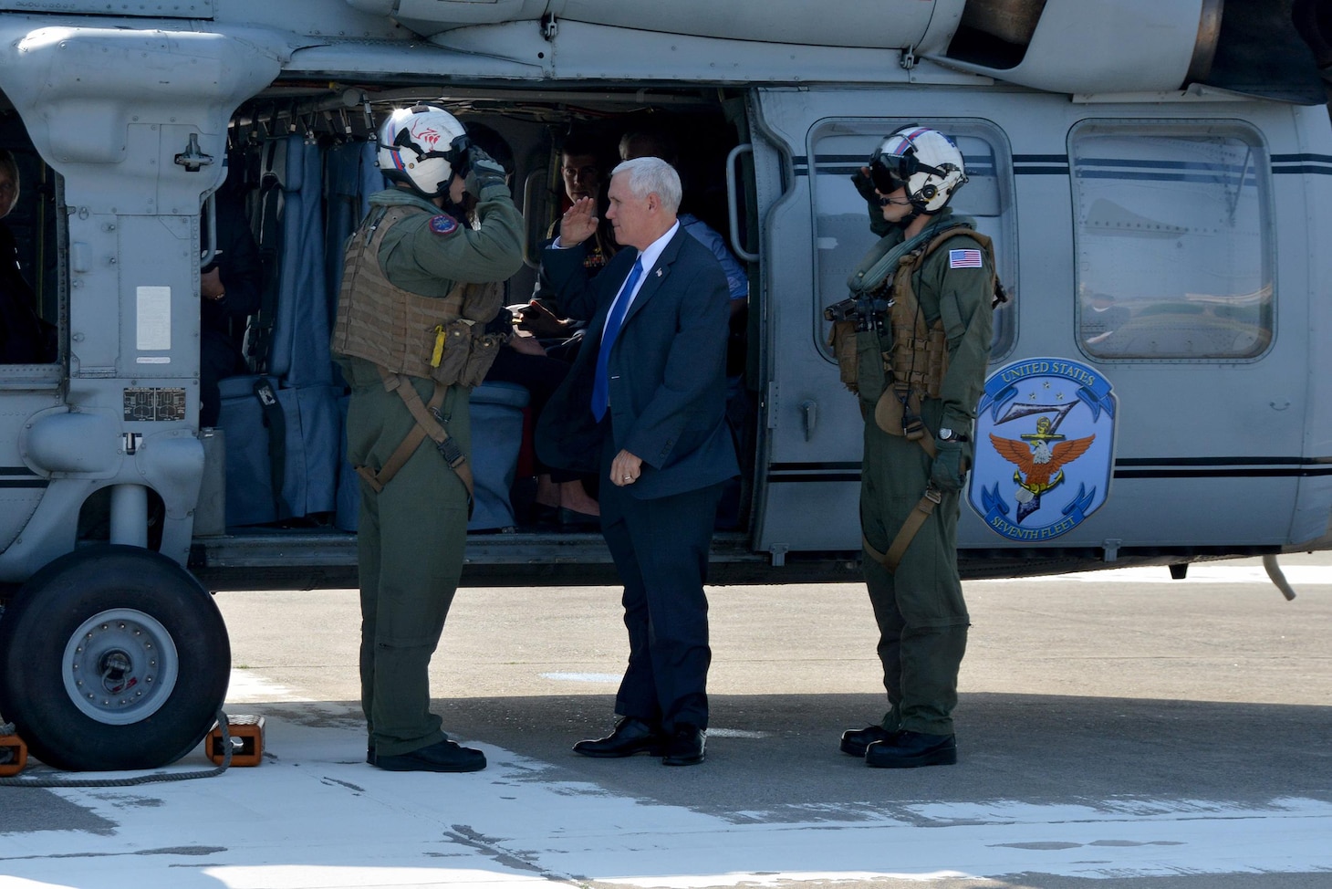 Vice President Mike Pence salutes the crew chief of Navy Two upon his arrival to Fleet Activities (FLEACT) Yokosuka. Pence's visit to Yokosuka Wednesday is part of official trip to the Asia-Pacific region reinforcing the United States' full commitment to its security alliances, April 19, 2017. During the Vice President's visit he spoke with military leaders and later with Sailors aboard USS RONALD REAGAN (CVN 76). Fleet Activities Yokosuka provides, maintains, and operates base facilities and services in support of 7th Fleet's forward-deployed naval forces, 71 tenant commands, and 26,000 military and civilian personnel.