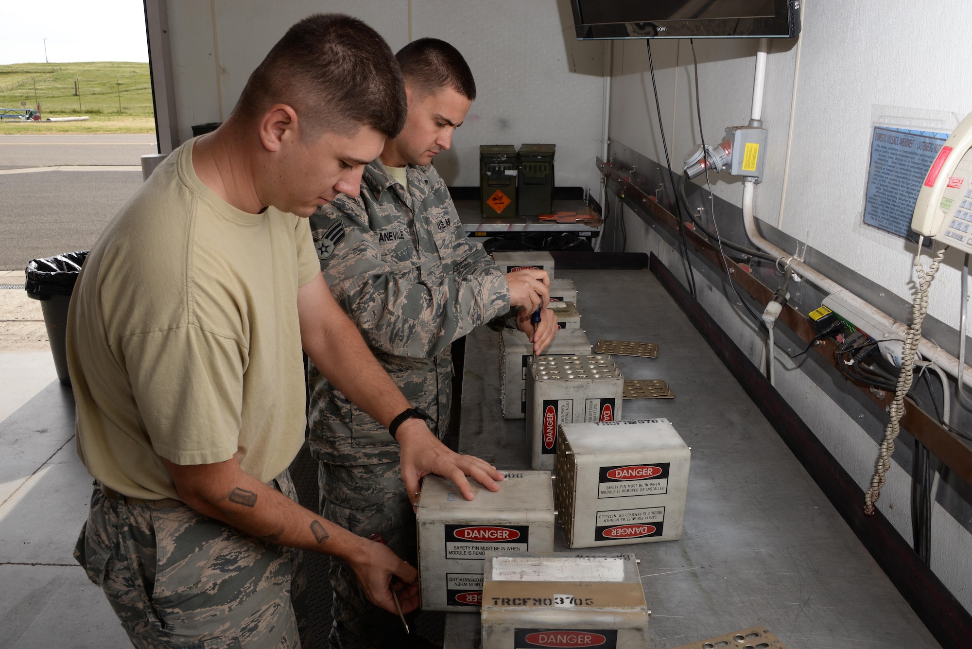 Senior Airman Ryan Laneville (Left) and Staff Sgt. Daniel Vendetta (Right), both members of the 60th Maintenance Squadron, break down flare mods at Travis Air Force Base, Calif., April 5, 2017. Laneville and Vendetta are part of the maintenance squadron's munitions team responsible for munitions valued at over $13 million. Flare mods are utilized by C-17 Globemaster III and C-5M Super Galaxy aircraft to counter airborne threats. (U.S. Air Force photo/Tech. Sgt. James Hodgman/Released)