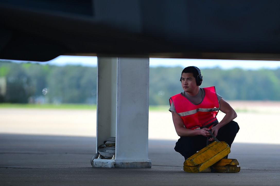 A crew chief from the 1st Maintenance Squadron 27th Aircraft Maintenance Unit performs a final checks on an F-22 Raptor during ATLANTIC TRIDENT 17 at Joint Base Langley-Eustis, Va., April 18, 2017. Approximately 225 U.S. Air Force, 175 Royal air force and 150 French air force service members participated in the exercise. (U.S. Air Force photo/Senior Airman Kimberly Nagle)