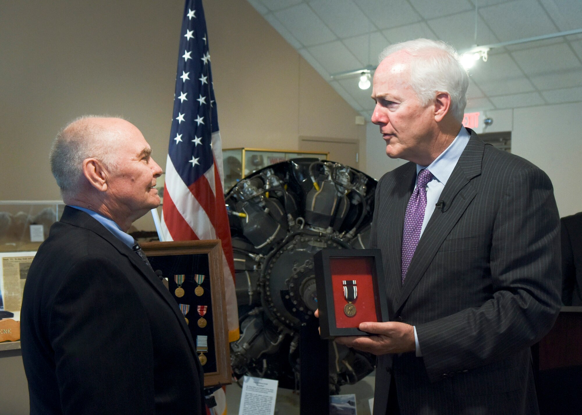 U.S. Sen. John Cornyn, R-TX, presents the POW medal to Dr. Stanley Scott Jr., son of U.S. Army Air Corps Capt. Stanley Scott Sr., at the Dyess Museum in Abilene, Texas, April 18, 2017. Scott Sr. was held captive at the Wauwilermoos Camp in Switzerland during World War II. When France was liberated, he escaped into France and rejoined his unit. At the end of WWII, he entered the Reserves and was reactivated to active duty in 1950 when he retrained to fly jet fighters. (U.S. Air Force photo by Senior Airman Kedesha Pennant)